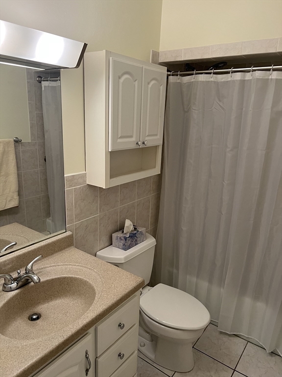 20 Colonial Drive, Unit 3 Andover, MA 01810 - Photo 19 of 24 a bathroom with a sink and a mirror