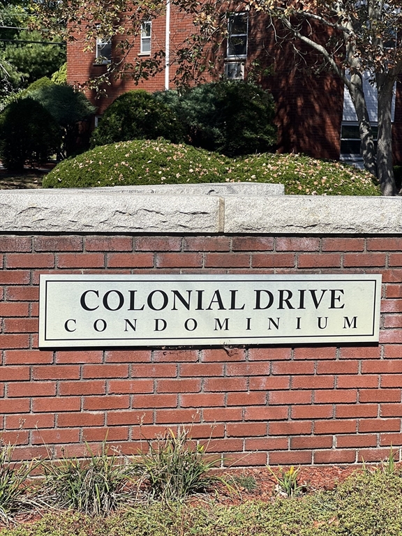 20 Colonial Drive, Unit 3 Andover, MA 01810 - Photo 2 of 24 a street sign on a street sign