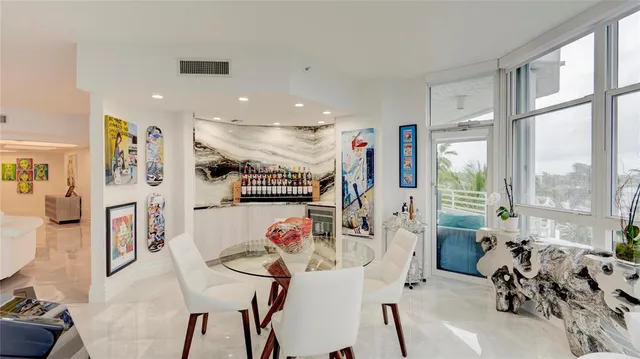 a view of a dining room with furniture window and outside view