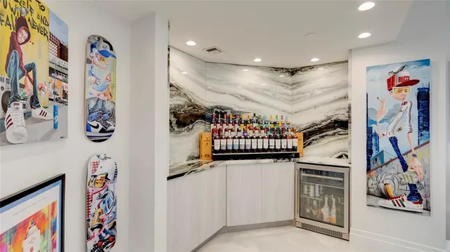 a kitchen with stainless steel appliances a sink and cabinets