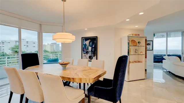 a view of a kitchen with furniture and a large window