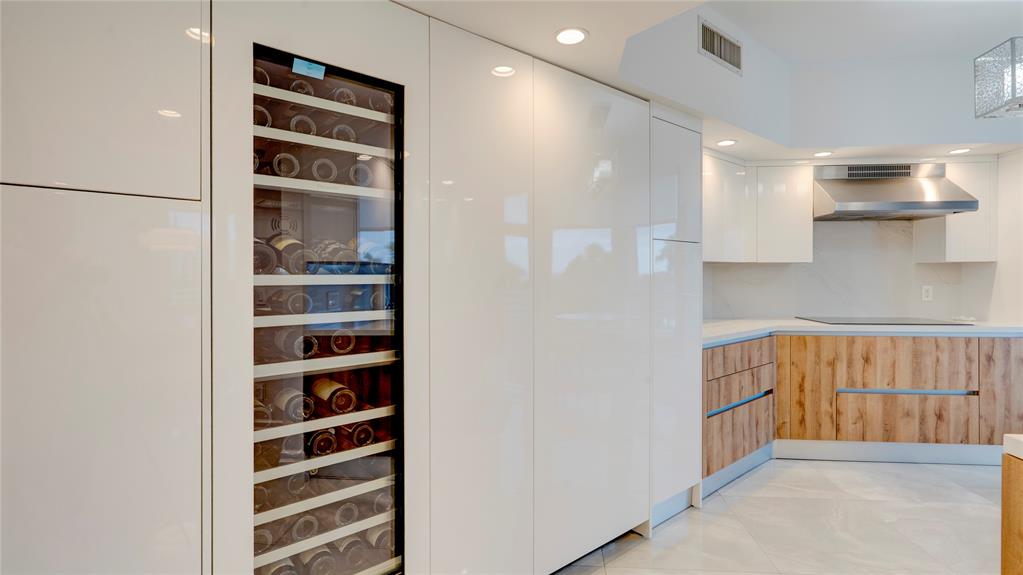1440 South Ocean Boulevard, Unit 5C Pompano Beach, FL 33062 - Photo 21 of 71 a view of kitchen with stainless steel appliances cabinets and a refrigerator