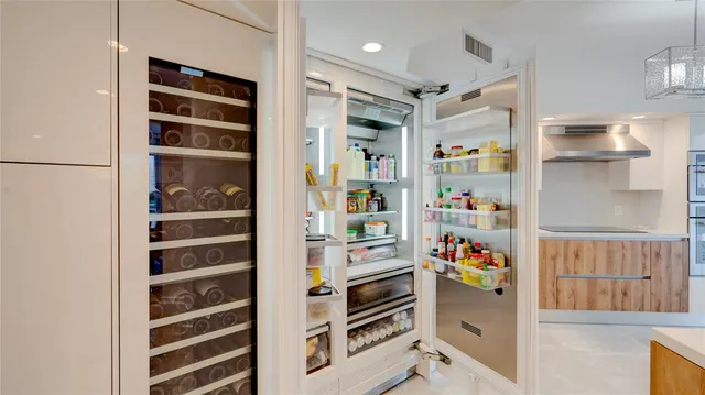 a bedroom with a bed dresser and a large mirror