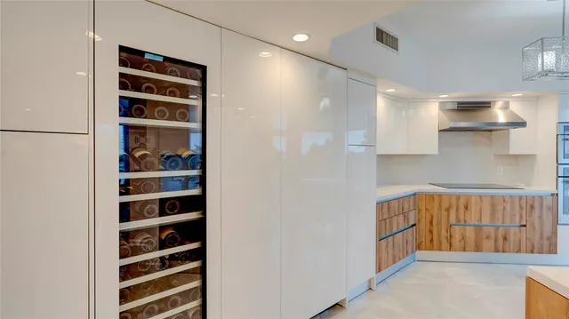 a bathroom with a double vanity sink toilet mirror and shower