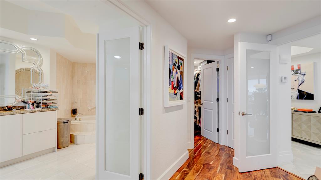 1440 South Ocean Boulevard, Unit 5C Pompano Beach, FL 33062 - Photo 35 of 71 a view of a hallway with bathroom and wooden floor