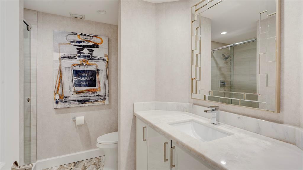 1440 South Ocean Boulevard, Unit 5C Pompano Beach, FL 33062 - Photo 43 of 71 a bathroom with a sink toilet and shower