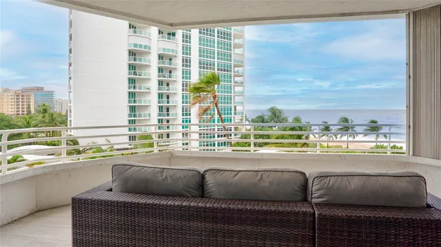 a view of balcony with wooden floor and bench