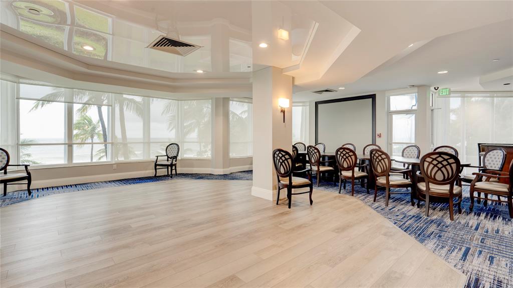 1440 South Ocean Boulevard, Unit 5C Pompano Beach, FL 33062 - Photo 61 of 71 a very nice looking room with lots of tables a large window and furniture