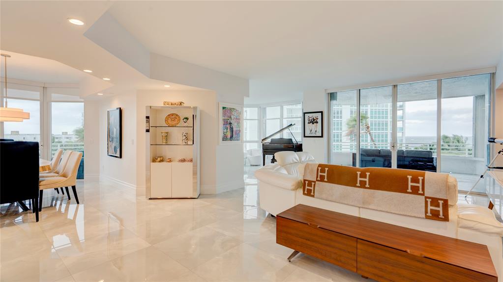 1440 South Ocean Boulevard, Unit 5C Pompano Beach, FL 33062 - Photo 9 of 71 a living room with furniture and a large window