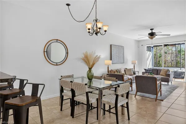 a kitchen with granite countertop white cabinets stainless steel appliances and a sink