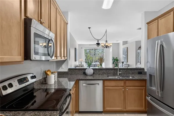 a bedroom with a bed and a lamp