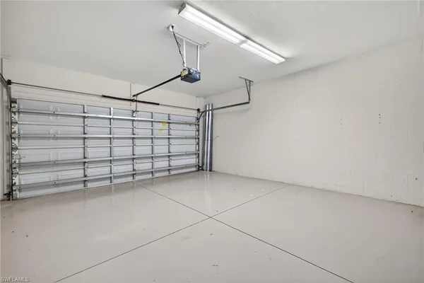 a view of a chairs and table in backyard