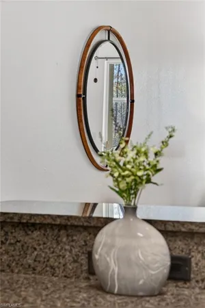 a view of a fountain in front of a house with a fountain