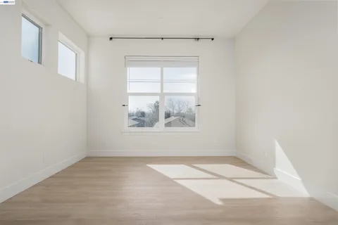 a bathroom with a granite countertop sink a mirror and shower