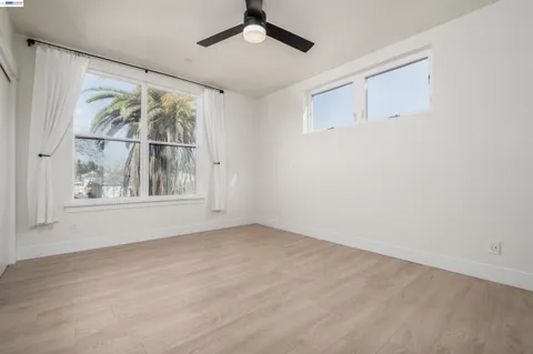 a bedroom with a bed and a table