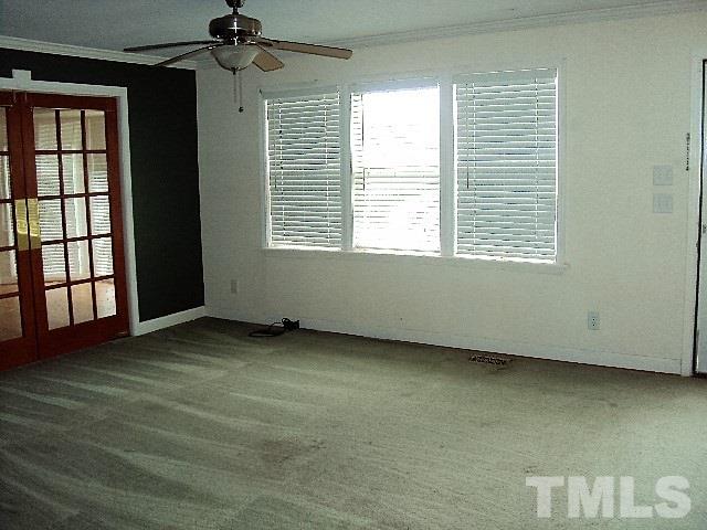3506 Planet Drive Raleigh, NC 27604 - Photo 2 of 14 a view of an empty room with a window