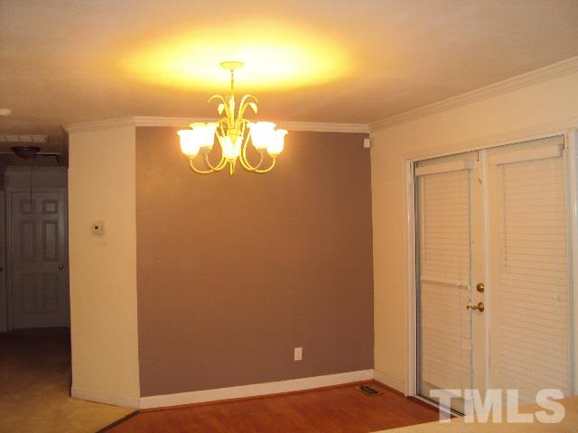 3506 Planet Drive Raleigh, NC 27604 - Photo 4 of 14 a view of a livingroom with a chandelier