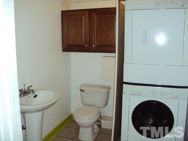 3506 Planet Drive Raleigh, NC 27604 - Photo 6 of 14 a bathroom with a toilet and a sink