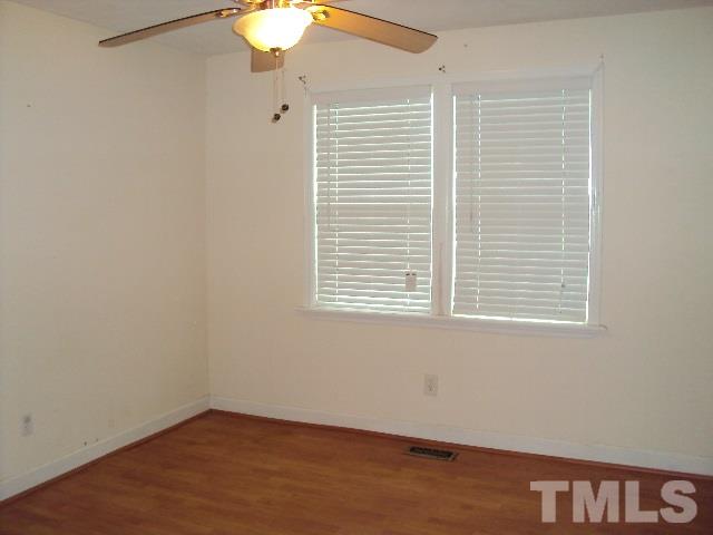 3506 Planet Drive Raleigh, NC 27604 - Photo 8 of 14 an empty room with a window