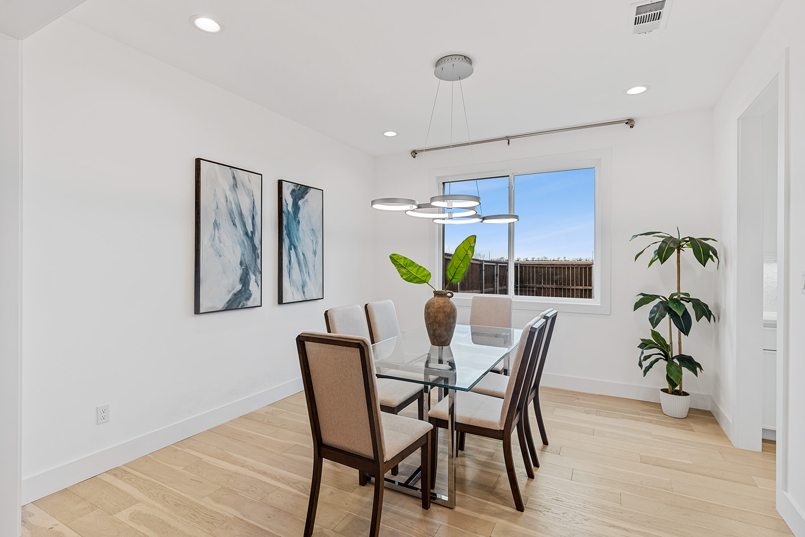 477 Willow Moon Ranch Road Crawford, TX 76638 - Photo 12 of 40 a view of a dining room with furniture and wooden floor