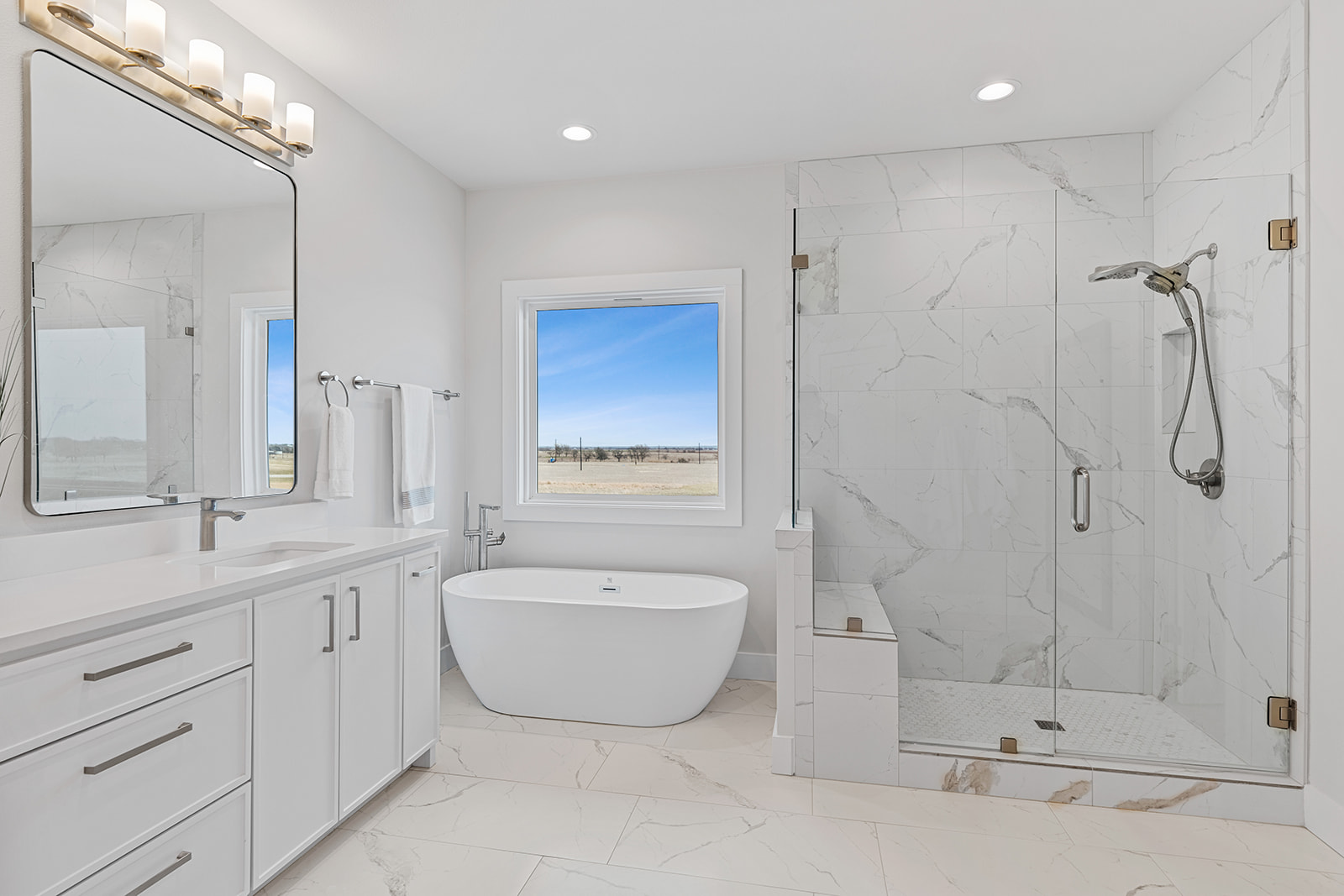 477 Willow Moon Ranch Road Crawford, TX 76638 - Photo 21 of 40 a bathroom with a double vanity sink mirror and shower