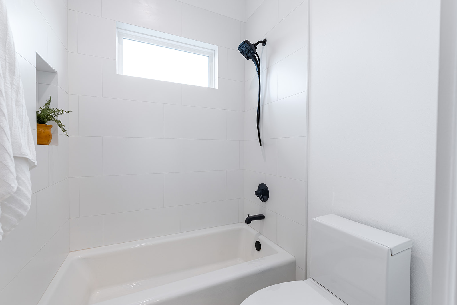 477 Willow Moon Ranch Road Crawford, TX 76638 - Photo 25 of 40 a bathroom with a bathtub a toilet and a shower