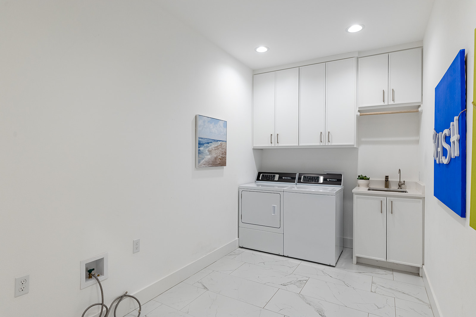 477 Willow Moon Ranch Road Crawford, TX 76638 - Photo 28 of 40 a kitchen with cabinets stove and white countertops