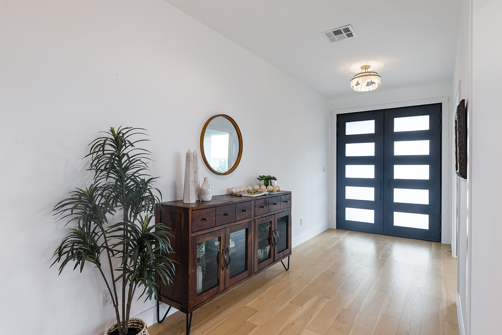 477 Willow Moon Ranch Road Crawford, TX 76638 - Photo 10 of 40 a view of a livingroom with furniture and wooden floor
