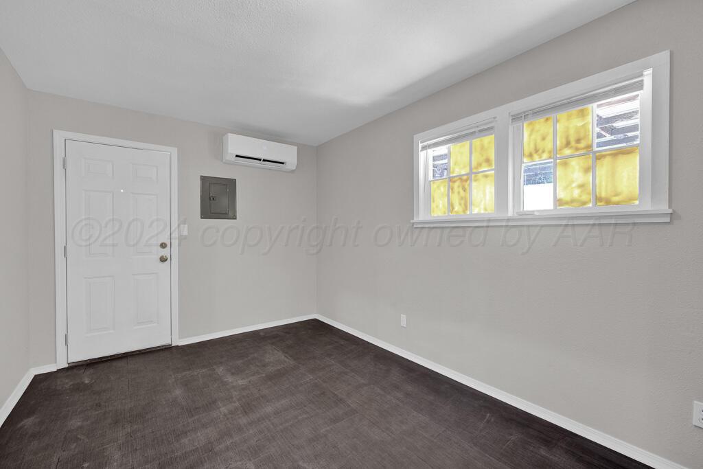 2103 North Marrs Street Amarillo, TX 79107 - Photo 8 of 11 a view of an empty room with a window