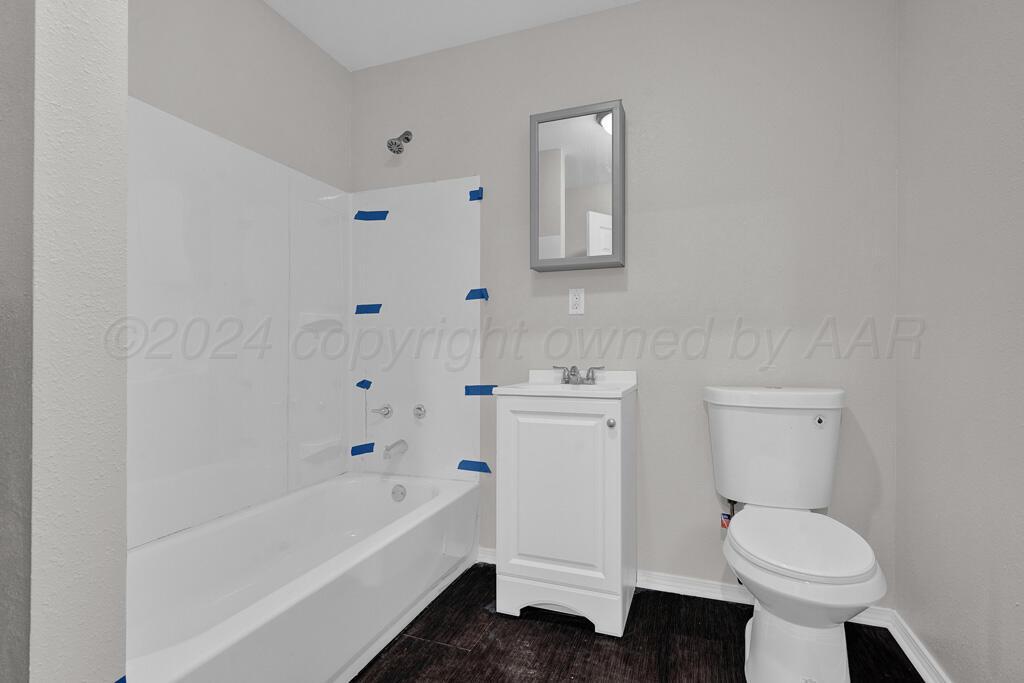 2103 North Marrs Street Amarillo, TX 79107 - Photo 10 of 11 a bathroom with a sink toilet and bathtub