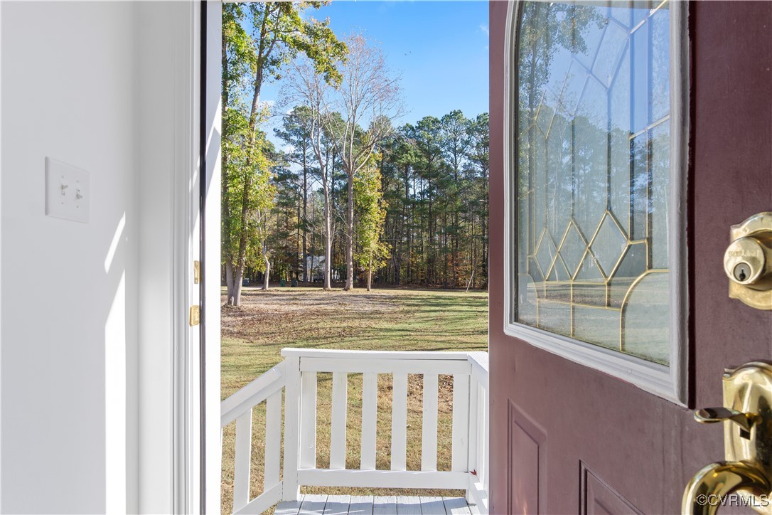 219 Barlow Road Williamsburg, VA 23188 - Photo 11 of 50 a view of a door and chair in the balcony