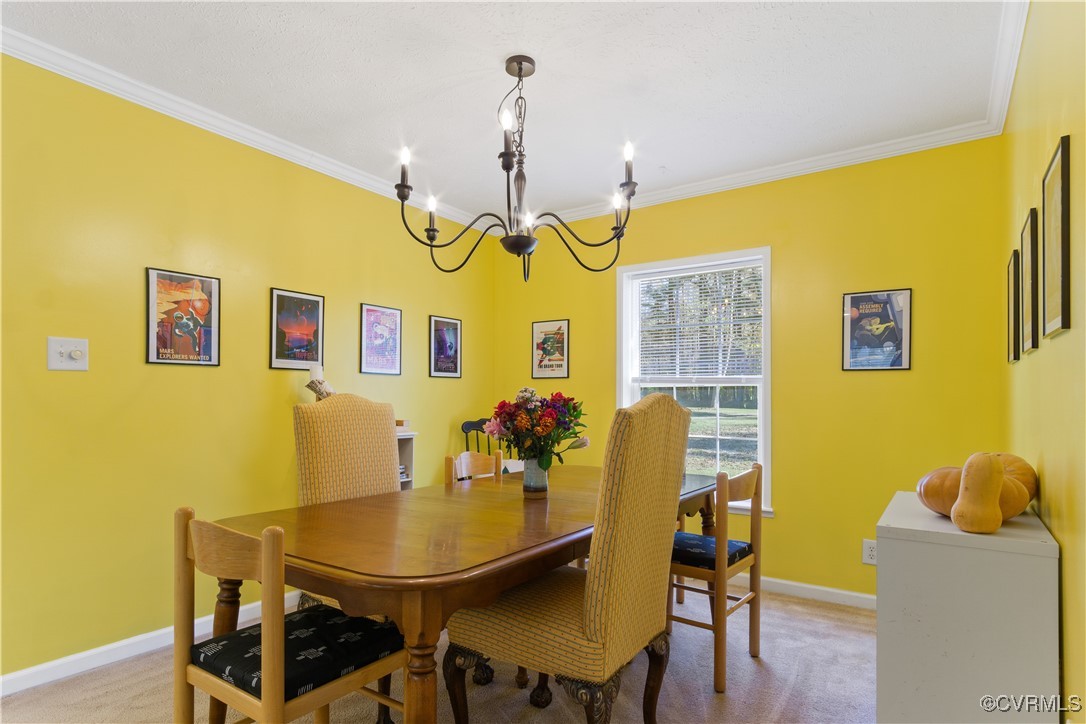 219 Barlow Road Williamsburg, VA 23188 - Photo 16 of 50 a view of a dining room with furniture and chandelier