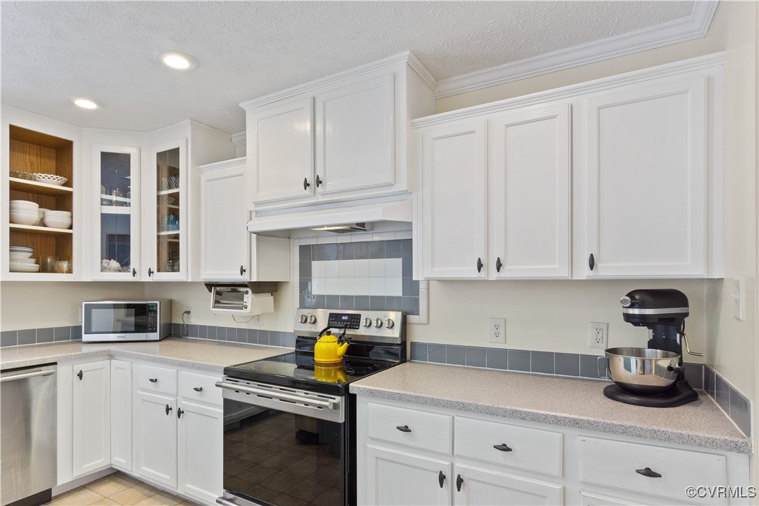 219 Barlow Road Williamsburg, VA 23188 - Photo 18 of 50 a kitchen with stainless steel appliances granite countertop white cabinets sink and dishwasher
