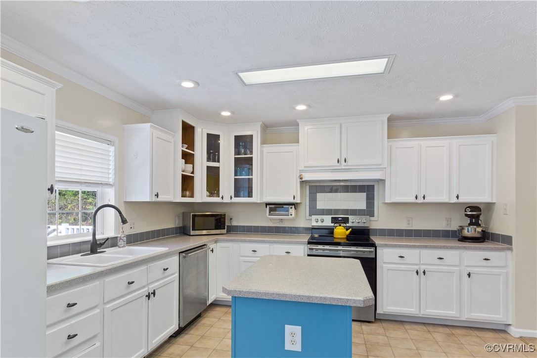219 Barlow Road Williamsburg, VA 23188 - Photo 19 of 50 a kitchen with granite countertop a stove sink and cabinets