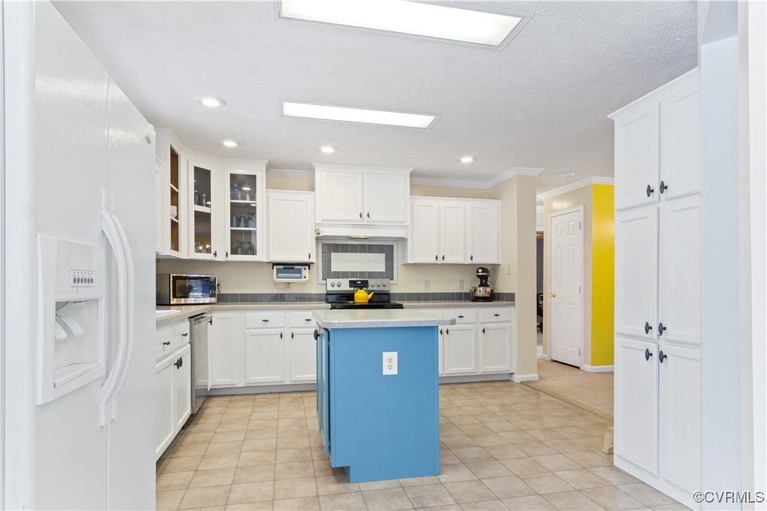 219 Barlow Road Williamsburg, VA 23188 - Photo 22 of 50 a kitchen with stainless steel appliances granite countertop a refrigerator and a stove top oven