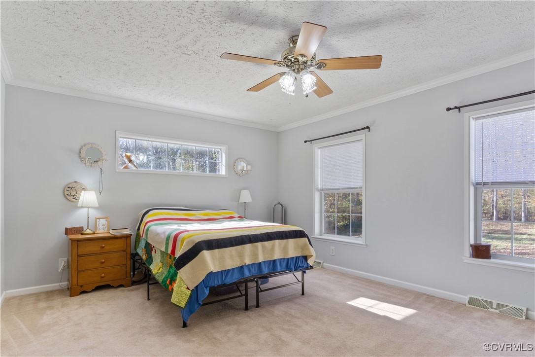 219 Barlow Road Williamsburg, VA 23188 - Photo 23 of 50 a bedroom with a bed and a window