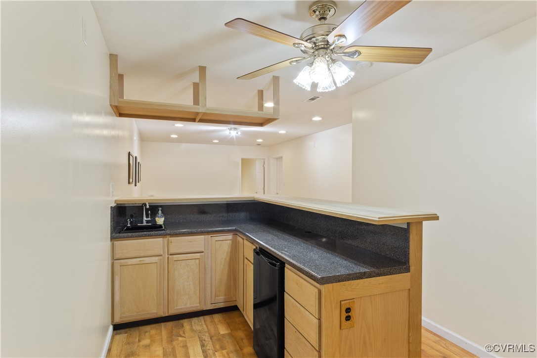 219 Barlow Road Williamsburg, VA 23188 - Photo 32 of 50 a kitchen with a sink dishwasher and white cabinets