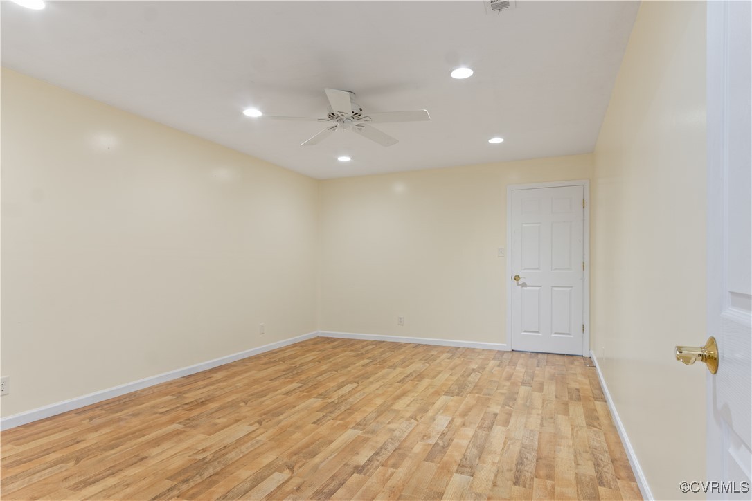 219 Barlow Road Williamsburg, VA 23188 - Photo 36 of 50 an empty room with wooden floor and windows