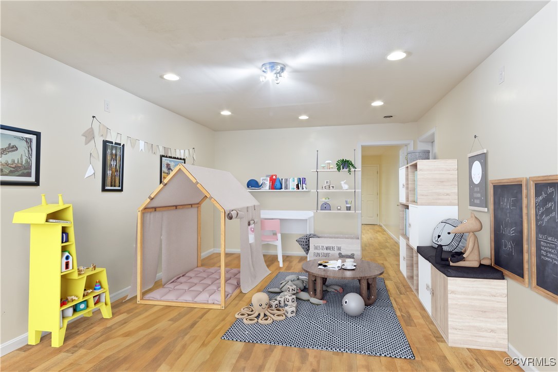 219 Barlow Road Williamsburg, VA 23188 - Photo 38 of 50 a living room with furniture and a wooden floor
