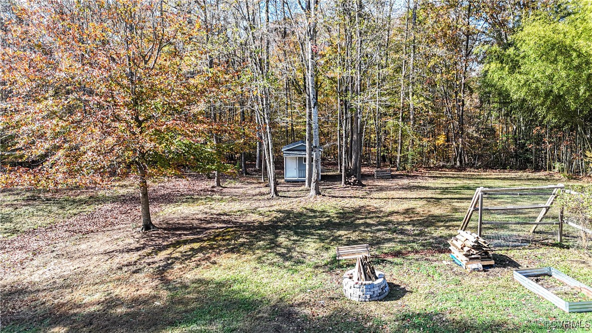 219 Barlow Road Williamsburg, VA 23188 - Photo 50 of 50 a backyard of a house with lots of green space