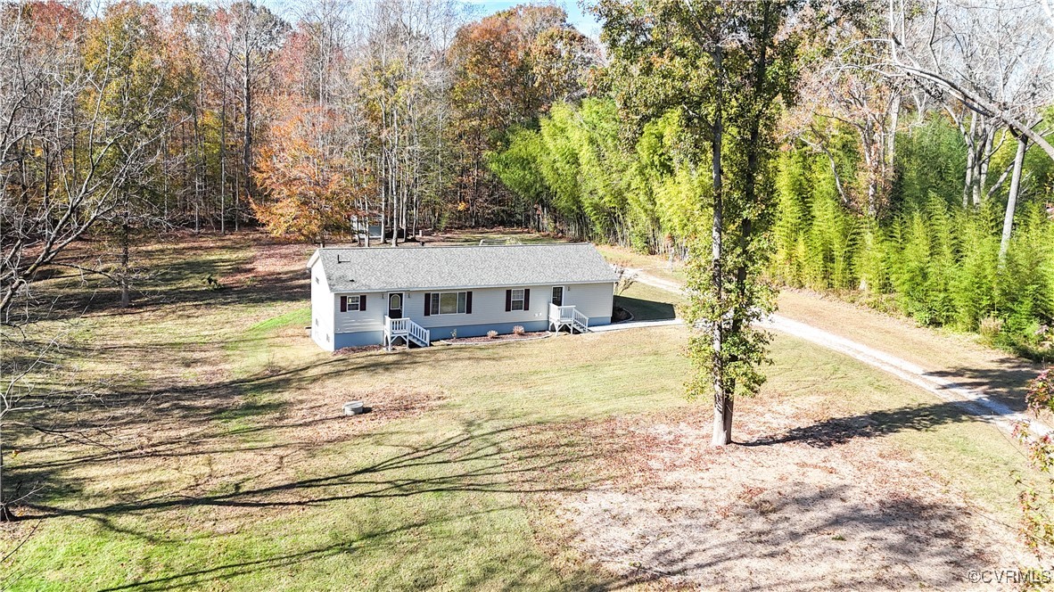 219 Barlow Road Williamsburg, VA 23188 - Photo 5 of 50 a house with trees in front of it