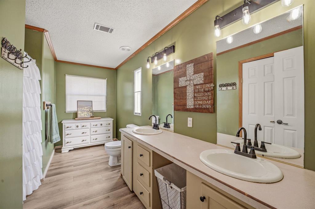 151 High Point Road Weatherford, TX 76088 - Photo 14 of 40 a bathroom with a granite countertop sink mirror and double