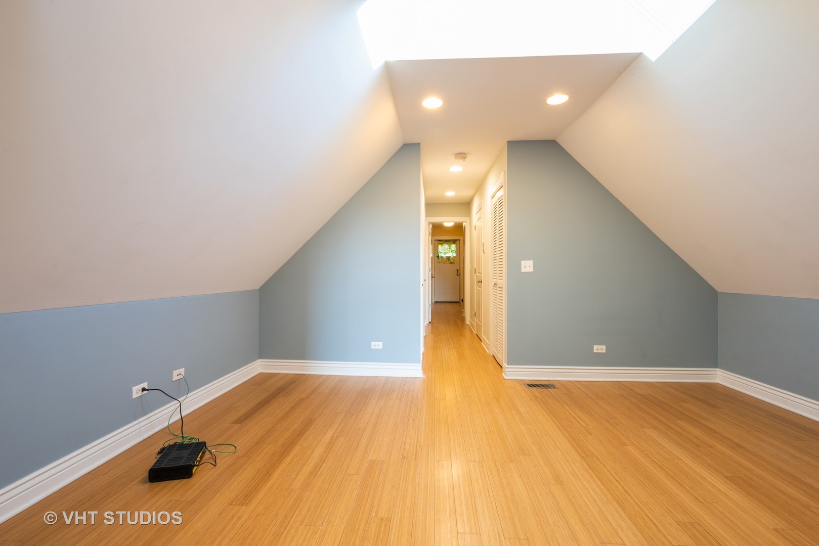 3258 North Racine Avenue, Unit 3 Chicago, IL 60657 - Photo 11 of 19 a view of a hallway with wooden floor