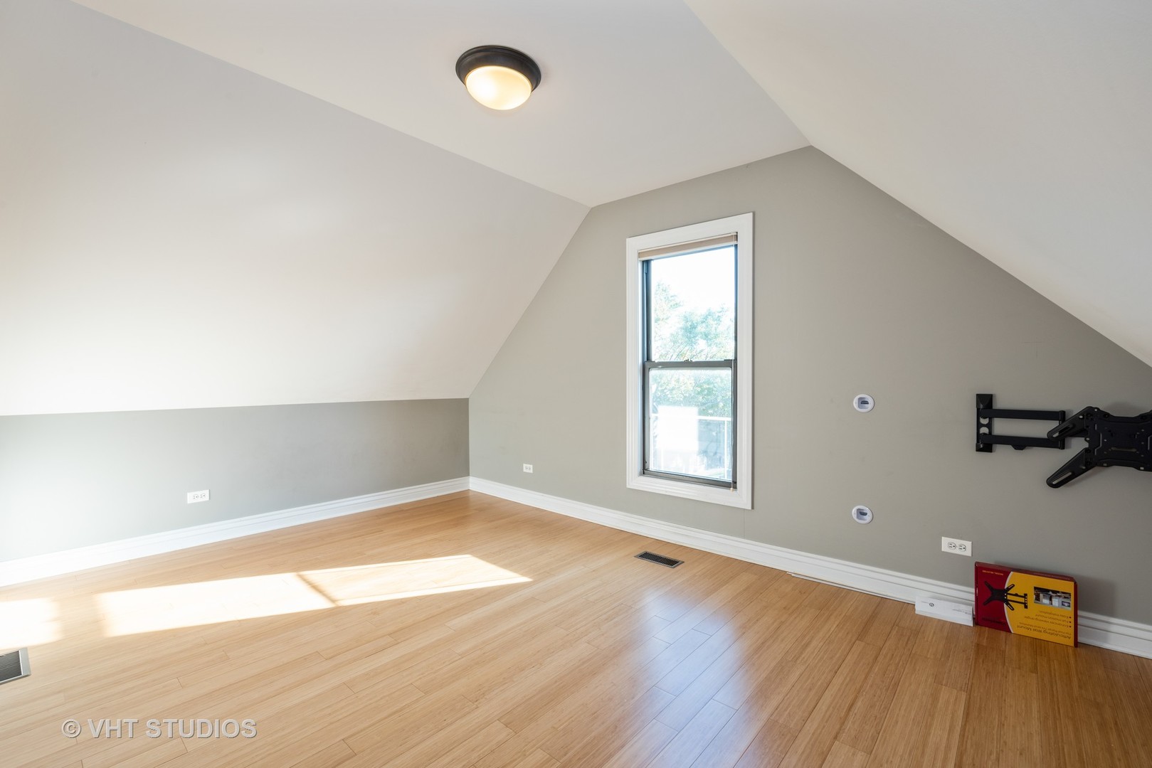 3258 North Racine Avenue, Unit 3 Chicago, IL 60657 - Photo 14 of 19 an empty room with wooden floor and windows