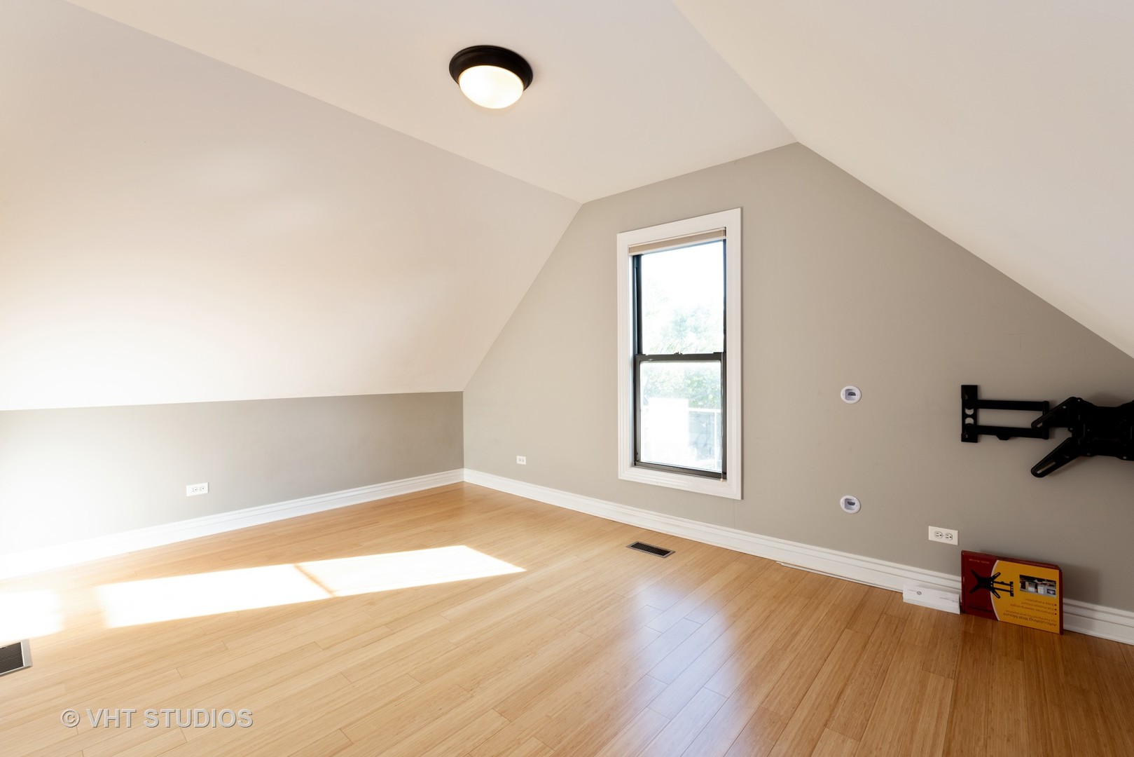 3258 North Racine Avenue, Unit 3 Chicago, IL 60657 - Photo 15 of 19 an empty room with wooden floor and windows