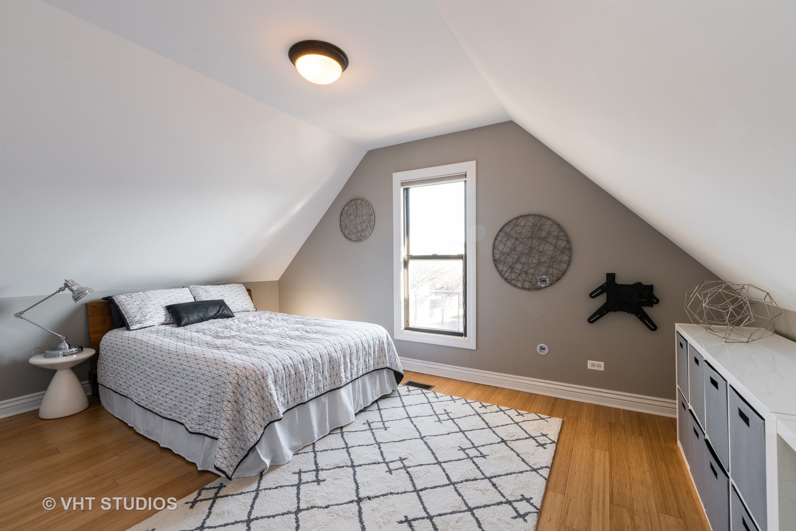 3258 North Racine Avenue, Unit 3 Chicago, IL 60657 - Photo 16 of 19 a spacious bedroom with a bed and a window