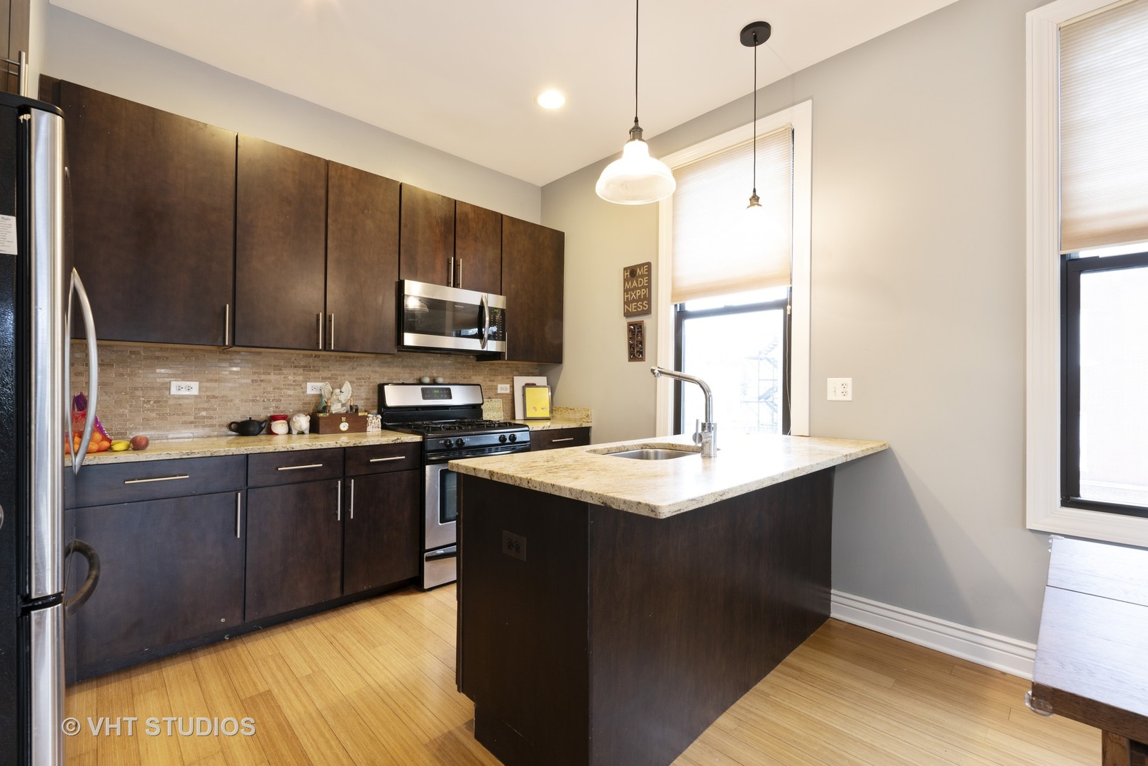 3258 North Racine Avenue, Unit 3 Chicago, IL 60657 - Photo 6 of 19 a kitchen with stainless steel appliances granite countertop a sink a stove and refrigerator