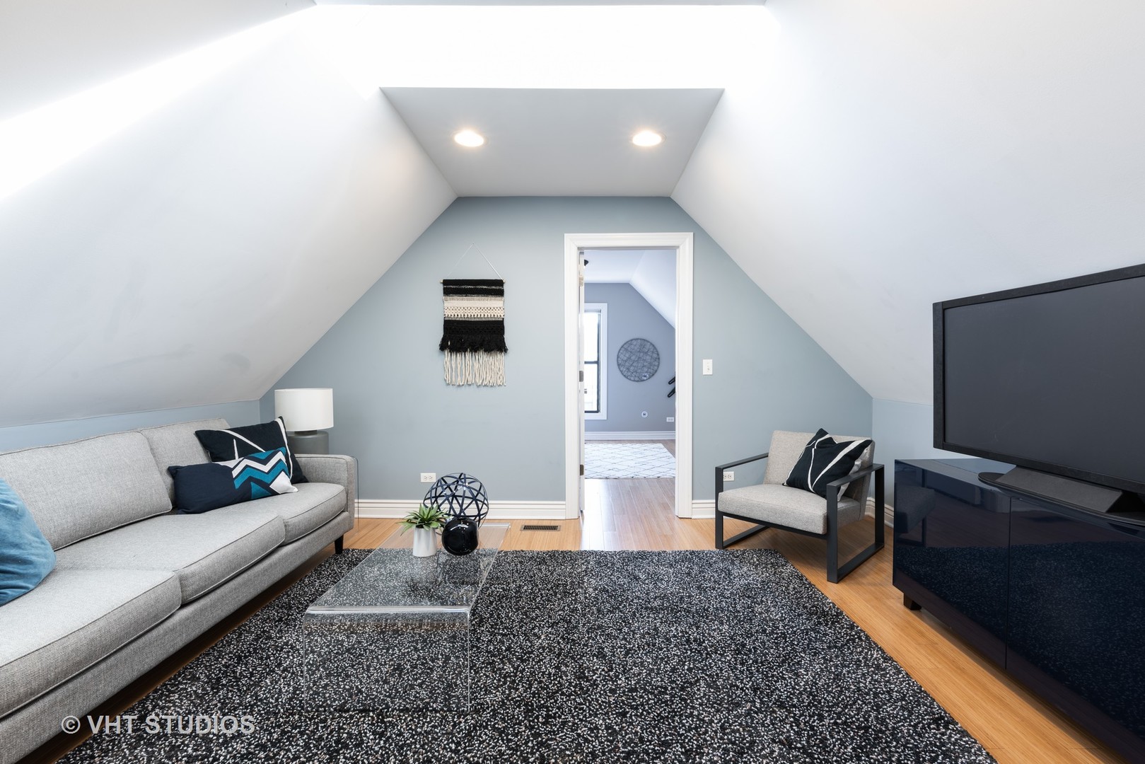 3258 North Racine Avenue, Unit 3 Chicago, IL 60657 - Photo 8 of 19 a living room with furniture and a flat screen tv