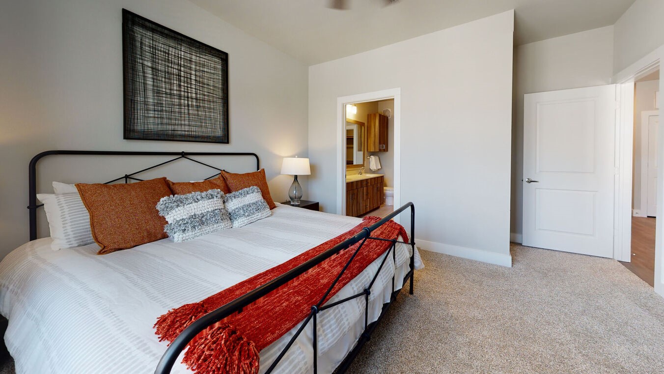 24002 Colonial Parkway, Unit 1204 Katy, TX 77493 - Photo 17 of 31 a bed sitting in a bedroom next to a window