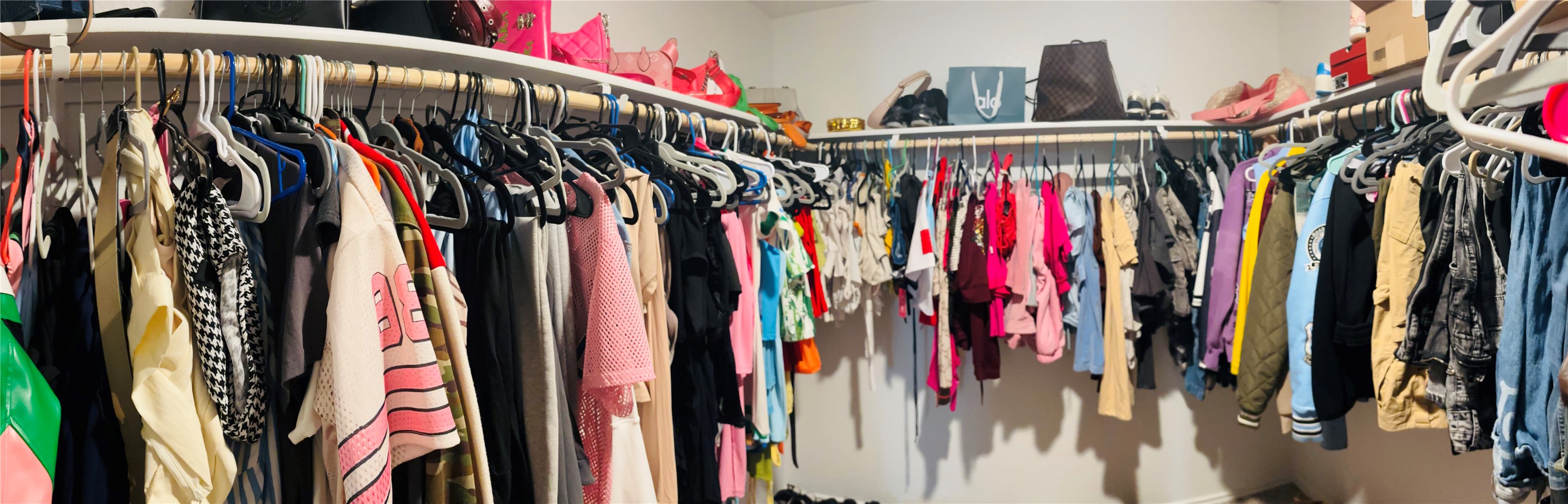 14817 Perlino Way, Unit A Manor, TX 78653 - Photo 21 of 40 a view of walk in closet with clothes